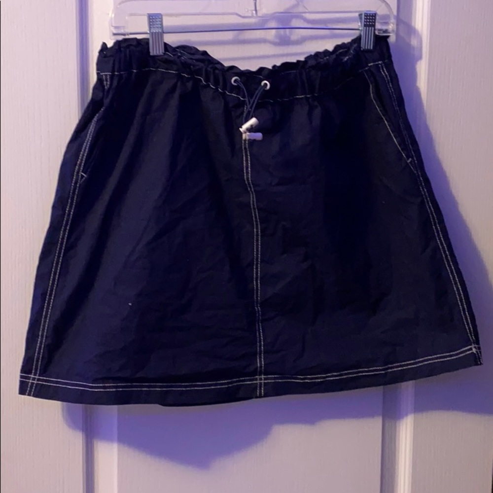 A navy blue skirt with white threading
